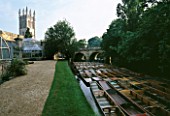 GLASSHOUSES AT OXFORD BOTANIC GARDEN WITH MAGDALEN COLLEGE  PUNTING BOATS  AND BRIDGE ON RIVER CHERWELL