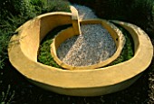 THE SNAIL  A GRAVEL SEATING AREA MADE FROM RENDERED CONCRETE WITH CAMOMILE SEATS FOR FRAGRANCE. DESIGNER: MARK LAURENCE