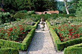 THE PRIORY  BEECH HILL  BERKSHIRE: THE NEW ROSE PARTERRE WITH BOX EDGING  STONE URN WITH PHORMIUM AND WHITE BEGONIAS