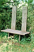 OAK BENCH BY MARY RAWLINSON IN THE GLADE AT FOVANT HUT  WILTSHIRE