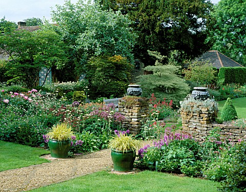 PETTIFERS__OXFORDSHIRE_BORDER_BY_THE_HOUSE_WITH_PEONY_BOWL_OF_BEAUTY__ALLIUM_ALBOPILOSUM__STACHYS_MA
