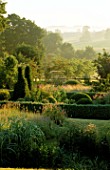 PETTIFERS  OXFORDSHIRE: EARLY MORNING VIEW ACROSS THE PARTERRE TO THE COUNTRYSIDE BEYOND