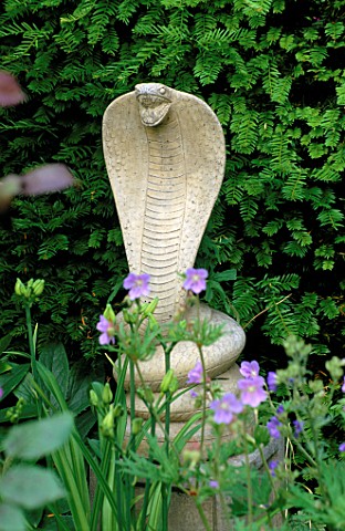 WOODCHIPPINGS__NORTHANTS_STONE_COBRA_FLANKING_THE_YEW_ARCH