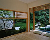 CHELSEA FLOWER SHOW 2004: JAPANESE GARDEN BY THE JAPANESE GARDEN SOCIETY. VIEW THROUGH SHOJI SCREENS TO TIERED LAWN  STEPPING STONES AND CLOUD HEDGING