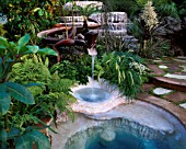 CHELSEA 2004: 100 % PURE NEW ZEALAND ORA: STEAMING MINERAL POOL  THERMAL TERRACE  FERNS  CORDYLINE AND WOODEN LIZARD