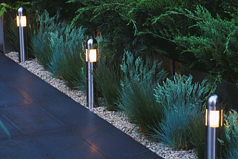 CHELSEA_2004_NOW_AND_ZEN_GARDEN_PATH_BORDERED_BY_GRASSES_LIT_UP_AT_NIGHT