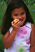 DESIGNER CLARE MATTHEWS: TREE HEART PROJECT. GIRL EATING APPLE