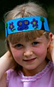 DESIGNER CLARE MATTHEWS: CHILDRENS PARTY -  GIRL WEARING A PARTY HAT