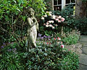 DESIGNER: SHEILA STEDMAN - FRONT GARDEN - STATUE SURROUNDED BY BLUEBELLS AND RHODODENDRONS