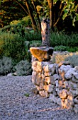 LA CHABAUDE  FRANCE. DESIGNER - PHILIPPE COTTET: STONE WALL WITH ROCK  GRAVEL TERRACE
