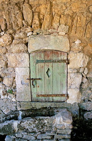 LA_CHABAUDE__FRANCE_DESIGNER__PHILIPPE_COTTET_DETAIL_OF_SMALL_DOOR_IN_WALL
