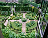 THE ABBEY HOUSE  WILTSHIRE: BOX CIRCLE WITH TOPIARY SHAPES AND IRISES SEEN FROM THE TOP WINDOW OF THE ABBEY HOUSE