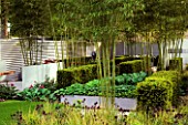 BAMBOO UNDERPLANTED WITH BOXED YEW HEDGING AND RAISED HOSTA BEDS  IN HIS LATE HIGHNESS SHAIKH ZAYED BIN SULTAN AL-NAYHANS GARDEN BY CHRISTOPHER BRADLEY-HOLE. CHELSEA 2005