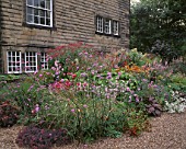 MAYROYD MILL HOUSE  YORKSHIRE: DESIGNERS: RICHARD EASTON AND STEVE MACKAY - HERBACEOUS PERENNIAL BORDER BESIDE THE HOUSE