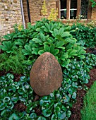 WINGWELL NURSERY  RUTLAND: EGG CERAMIC SCULPTURE BY ROSE DEJARDIN SURROUNDED BY RODGERSIA