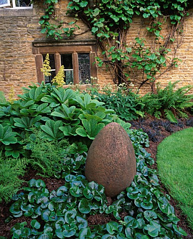 WINGWELL_NURSERY__RUTLAND_EGG_CERAMIC_SCULPTURE_BY_ROSE_DEJARDIN_SURROUNDED_BY_RODGERSIA