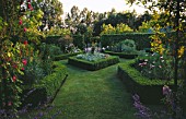 HALL FARM  LINCOLNSHIRE: GARDEN WITH FORMAL BOXED EDGED BEDS PLANTED WITH PERENNIALS