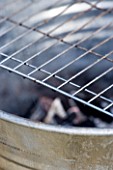 BARBEQUE PROJECT: METAL GRILL OVER BARBEQUE BUCKET. DESIGNER: CLARE MATTHEWS