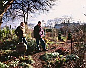 WOODCHIPPINGS  NORTHAMPTONSHIRE: RICHARD BASHFORD AND VALERIE BEXLEY IN THEIR GARDEN IN WINTER