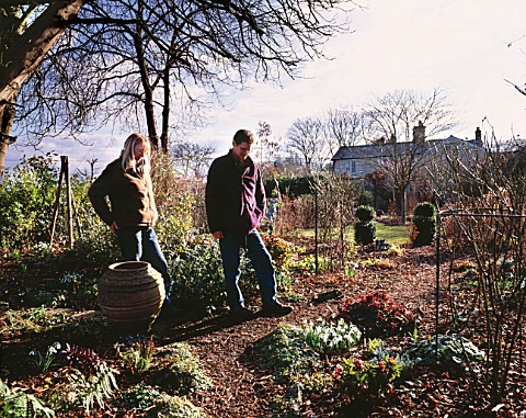 WOODCHIPPINGS__NORTHAMPTONSHIRE_RICHARD_BASHFORD_AND_VALERIE_BEXLEY_IN_THEIR_GARDEN_IN_WINTER