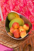 DESIGNER CLARE MATTHEWS: WIND BREAK SCREEN PROJECT: SILVER METAL FRUIT BOWL WITH MANGOES AND PEACHES