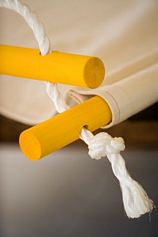 DESIGNER_CLARE_MATTHEWS_HANGING_SEAT_PROJECT__ROPE_THREADED_THROUGH_CANVAS_AND_DOWEL