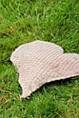 DESIGNER: CLARE MATTHEWS -THYME HEART PROJECT - THE HESSIAN AND WIRE HEART SHAPE FILLED WITH COMPOST