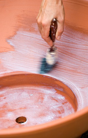 DESIGNER_CLARE_MATTHEWS__BUBBLING_BOWL_WATER_FEATURE_PROJECT_PAINTING_FILLER_ONTO_TERRACOTTA_POT