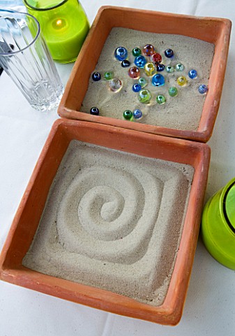 DESIGNER_CLARE_MATTHEWS__ZEN_TRAY_PROJECT__SAND_TRAYS_WITH_MARBLES_ON_TABLE