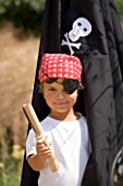 DESIGNER: CLARE MATTHEWS - CHILDRENS PARTY : BOY DRESSED AS A PIRATE WITH TREASURE MAP