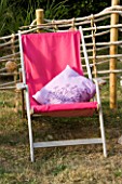 DESIGNER CLARE MATTHEWS: ROPE SCREEN HIDEAWAY - DECK CHAIR WITH PINK COVER AND LILAC CUSHION INSIDE ROPE SCREEN