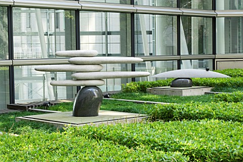 MARUNOUCHI_HOTEL__TOKYO__JAPAN_POLISHED_GRANITE_SCULPTURES_ON_STONE_PEDESTALS_WITH_OFFICE_BUILDING_B