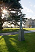 BRODSWORTH HALL  YORKSHIRE. ENGLISH HERITAGE. STATUE WITH CEDAR TREE AND HALL FRONT