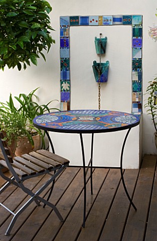 KATHY_TAYLORS_GARDEN__LONDON_A_PLACE_TO_SIT_MEDITERRANEAN_STYLE_TERRACE_WITH_MOSAIC_TABLE__CHAIR__WA