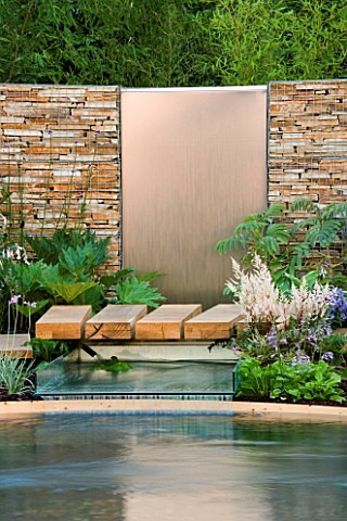 HAMPTON_COURT_FLOWER_SHOW_2006_DESIGNER__PAUL_MARTIN_DRY_STONE_WALL_WITH_METAL_WATER_FEATURE_WITH_FO