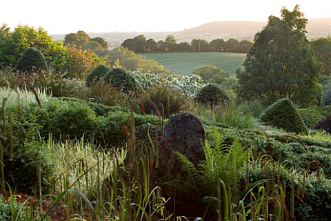 VEDDW_HOUSE_GARDEN__GWENT__WALES_DESIGNERS_ANNE_WAREHAM_AND_CHARLES_HAWES__VIEW_ACROSS_THE_GRASSES_P