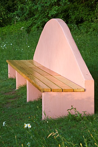 VEDDW_HOUSE_GARDEN__GWENT__WALES_DESIGNERS_ANNE_WAREHAM_AND_CHARLES_HAWES__PINK_SEAT_BENCH_ABOVE_THE