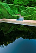 VEDDW HOUSE GARDEN  GWENT  WALES: DESIGNERS ANNE WAREHAM AND CHARLES HAWES - THE POOL GARDEN WITH REFLECTING POOL AND YEW HEDGES