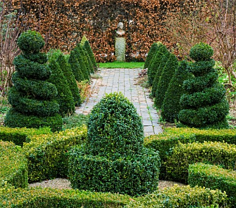 WOODPECKERS__WARWICKSHIRE__WINTER_FORMAL_KNOT_GARDEN_WITH_BOX_TOPIARY___PATH_AND_STATUE_AT_END_OF_VI