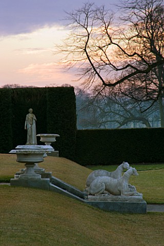 BRODSWORTH_HALL__YORKSHIRE__WINTER__URNS__GREYHOUND_STATUES_AND_YEW_HEDGING_AT_DAWN