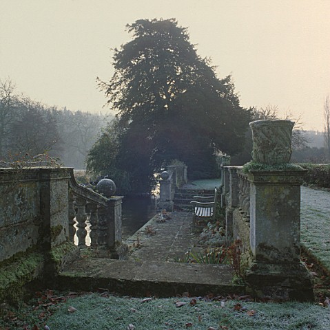 STONE_BALUSTRADED_STEPS_BY_HAROLD_PETO_LEAD_DOWN_TO_A_JETTY_ON_THE_AVON_AND_THE_WATER_MEADOWS_BEYOND