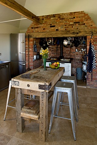 BOONSHILL_FARM__EAST_SUSSEX_INTERIOR_OF_KITCHEN_WITH_AGA_AND_BUTCHERS_BLOCK_ON_STAND_MADE_BY_MICK_SH