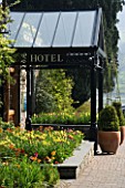 THE LAKESIDE HOTEL  CUMBRIA. FRONT ENTRANCE WITH TULIPS AND WALLFLOWERS
