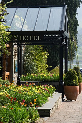 THE_LAKESIDE_HOTEL__CUMBRIA_FRONT_ENTRANCE_WITH_TULIPS_AND_WALLFLOWERS