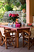 VILLA CHRISTINA   KAMINAKI  CORFU  GREECE: COVERED OUTDOOR PATIO/ TERRACE DINING AREA WITH WOODEN TABLE AND CHAIRS SET FOR ALFRESCO DINING