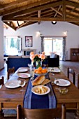 VILLA CHRISTINA   KAMINAKI  CORFU  GREECE: THE LIVING/ DINING ROOM WITH TABLE
