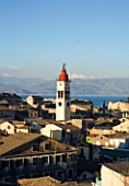 CORFU  GREECE: VIEW OF CORFU TOWN ROOFTOPS WITH ST SPYRIDONS BELLTOWER AND CORFU MOUNTAINS BEHIND