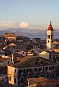 CORFU  GREECE: VIEW OF CORFU TOWN ROOFTOPS WITH ST SPYRIDONS BELLTOWER AND CORFU MOUNTAINS BEHIND