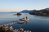 CORFU  GREECE: VIEW OF PONTIKONISSI OR MOUSE ISLAND AND VLACHERNA WITH ITS WHITE CONVENT  AT SUNSET