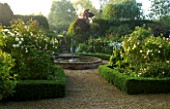 MARINERS GARDEN  BERKSHIRE. DESIGNER FENJA ANDERSON - THE ROSE GARDEN AT DAWN - ROSE PROSPERITY  ROSE COMPTE DE CHAMBORD  ROSA SANCTA AND BOX EDGING WITH FOUNTAIN IN THE CENTRE